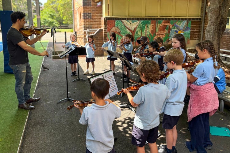 school strings ensemble performing