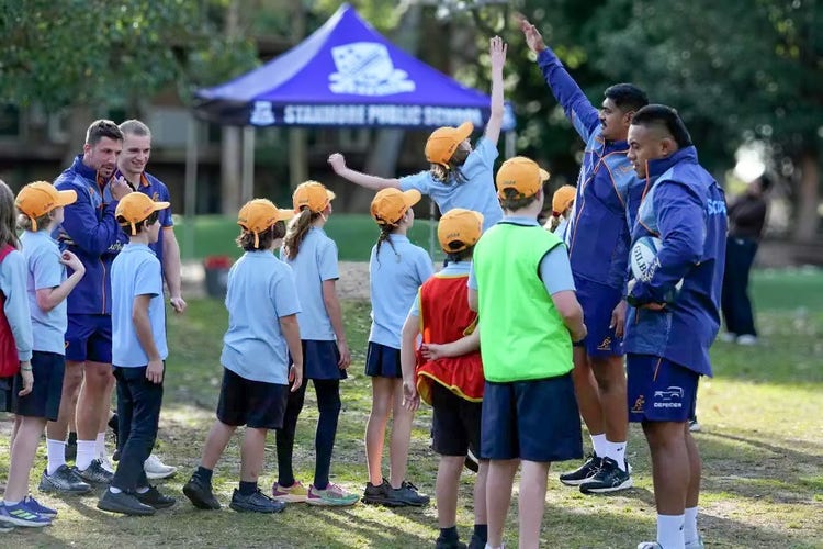Wallabies rugby players during their school visit