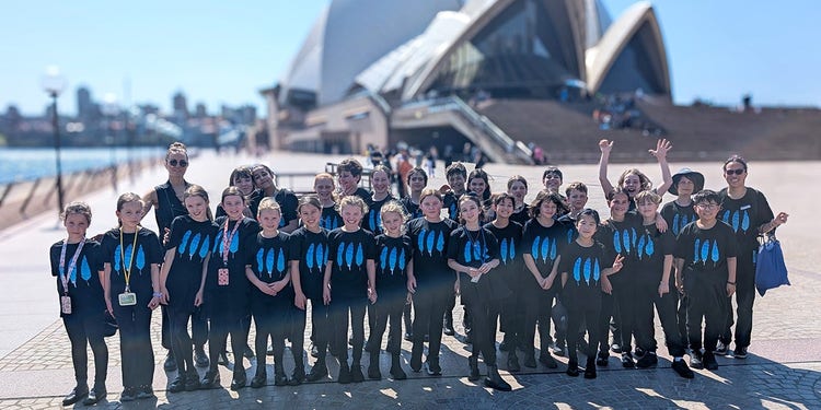 students in front of opera house