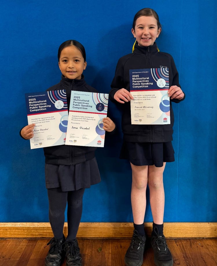 photo of students holding awards