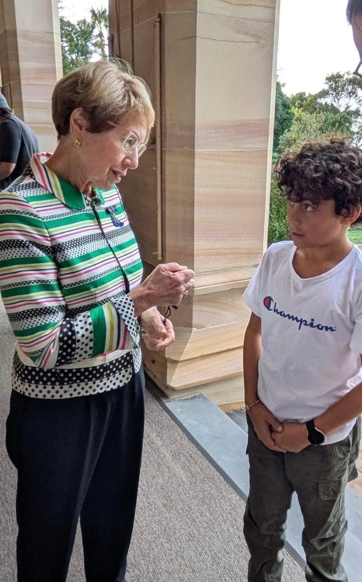 A photo of blake standing with the governor