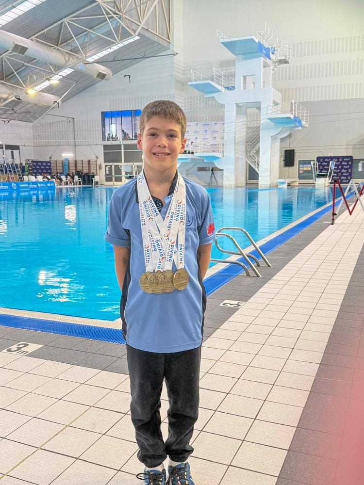 photo of lucas standing in front of pool