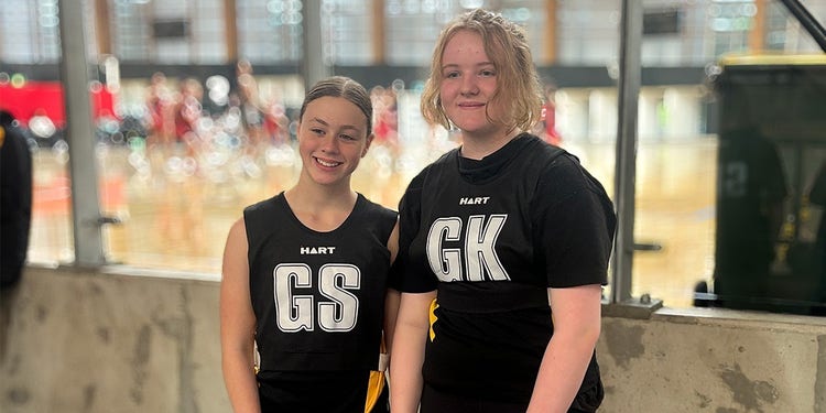 photo of cara and eliza at the netball courts