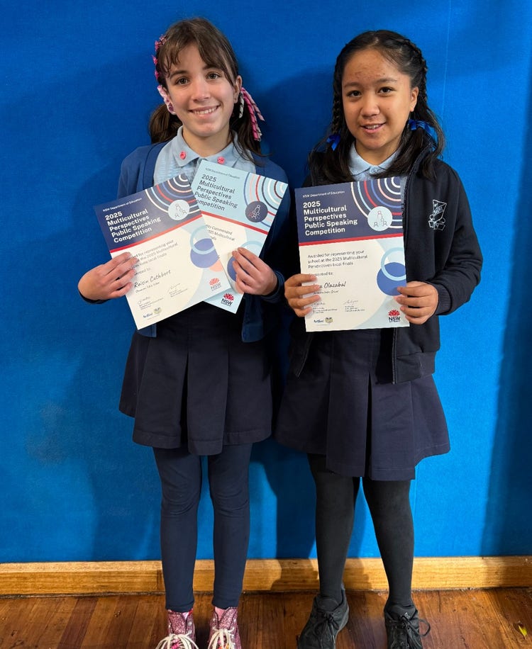 photo of students holding awards